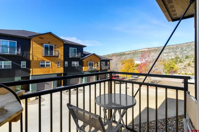 a view of staircase with a small yard