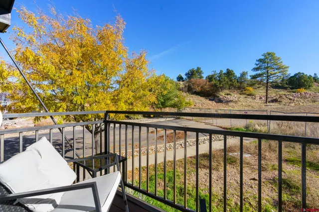 a view of balcony with furniture