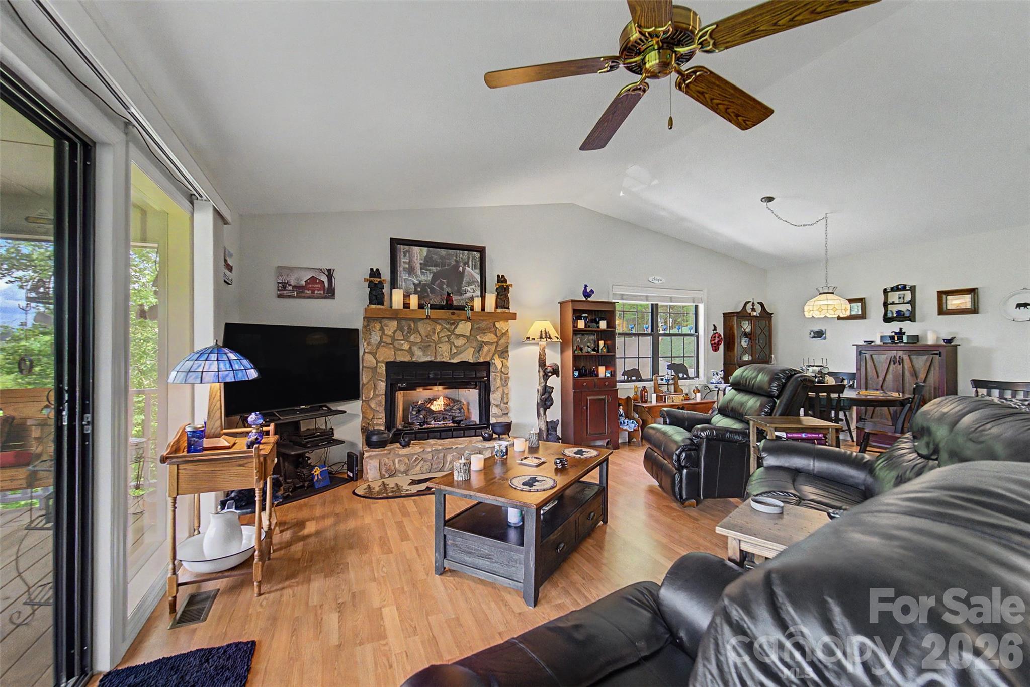 531 Reserve Road Franklin, NC 28734 - Photo 10 of 41 a living room with furniture a fireplace and a window