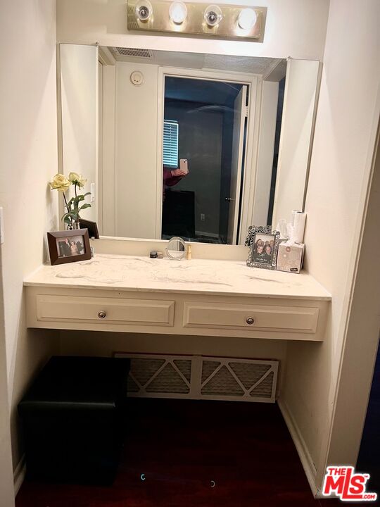 1935 Alpha Road, Unit 114 Glendale, CA 91208 - Photo 11 of 12 a bathroom with a sink and a mirror