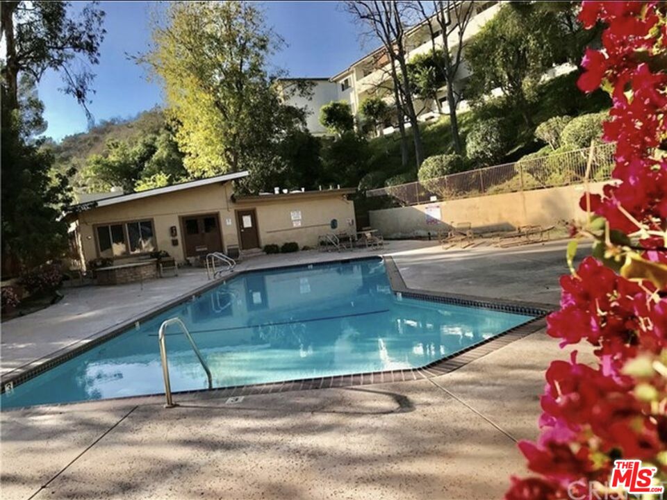 1935 Alpha Road, Unit 114 Glendale, CA 91208 - Photo 12 of 12 a view of a swimming pool with a patio