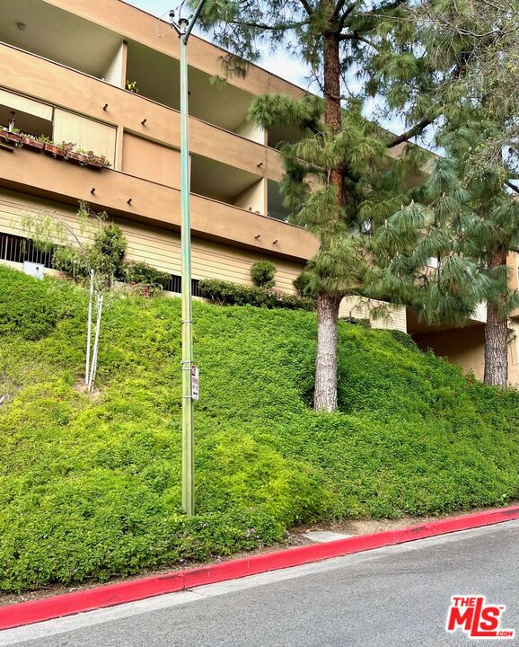 1935 Alpha Road, Unit 114 Glendale, CA 91208 - Photo 2 of 12 a view of a wooden fence