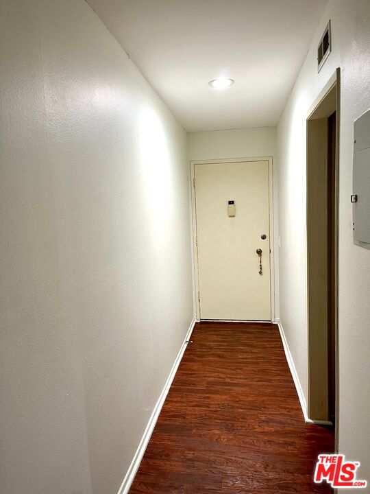 1935 Alpha Road, Unit 114 Glendale, CA 91208 - Photo 3 of 12 a view of a hallway with wooden floor
