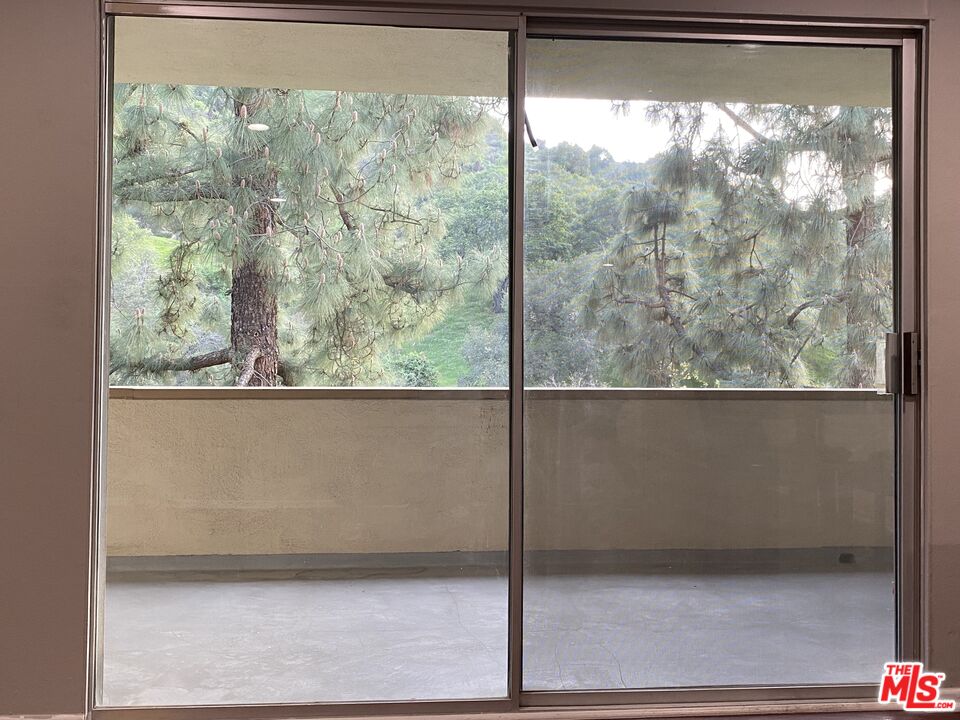 1935 Alpha Road, Unit 114 Glendale, CA 91208 - Photo 5 of 12 a view of a room with a large window