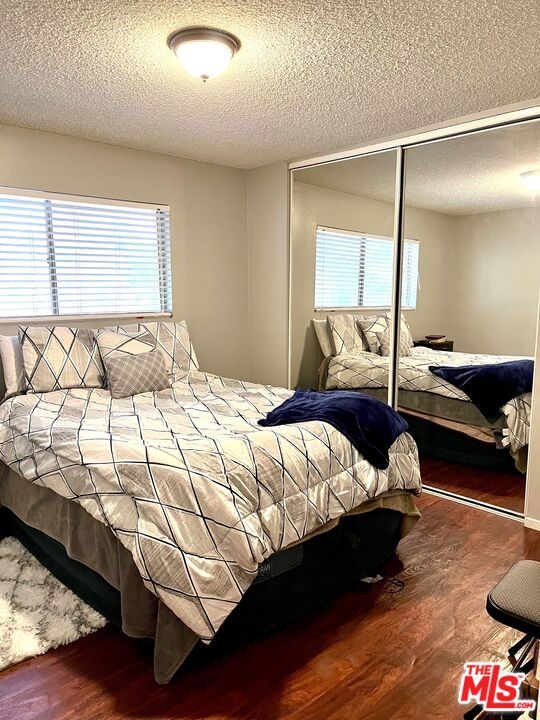 1935 Alpha Road, Unit 114 Glendale, CA 91208 - Photo 9 of 12 a bedroom with a bed and window