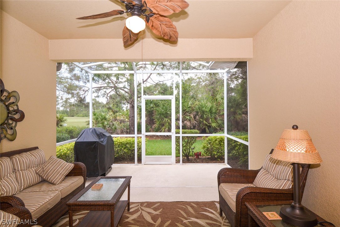 4704 Fairloop Run Lehigh Acres, FL 33973 - Photo 12 of 25 a living room with furniture and a window