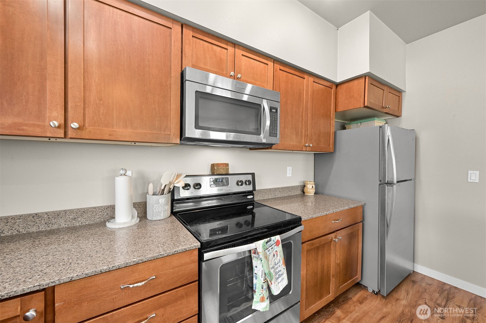 8844 Depot Road, Unit B211 Lynden, WA 98264 - Photo 14 of 29 a kitchen with stainless steel appliances granite countertop a refrigerator sink and stove