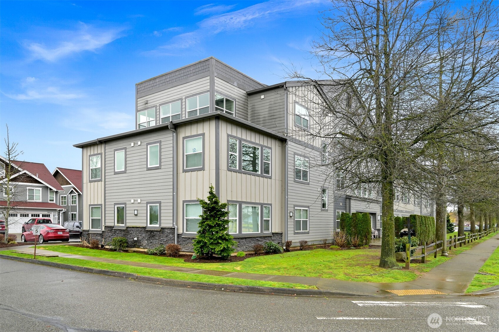 8844 Depot Road, Unit B211 Lynden, WA 98264 - Photo 29 of 29 a front view of residential houses with yard and green space
