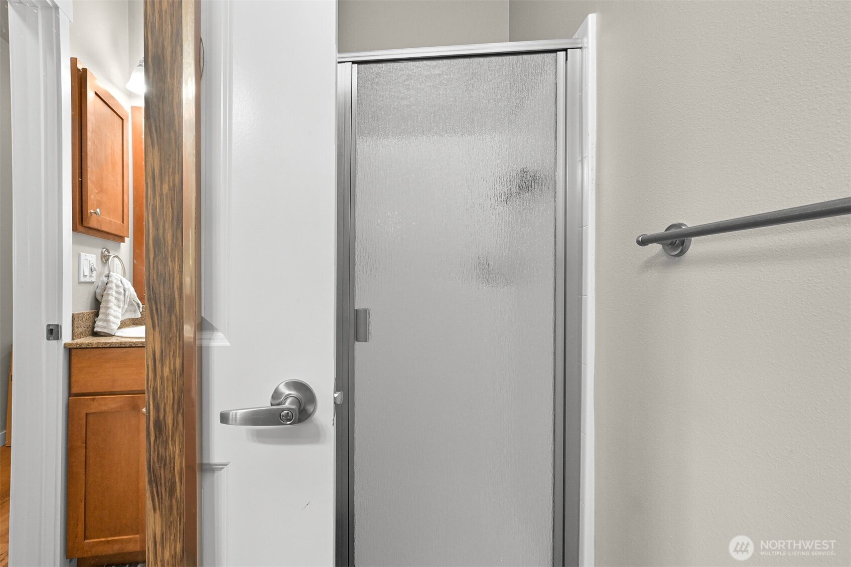 8844 Depot Road, Unit B211 Lynden, WA 98264 - Photo 5 of 29 a bathroom with a glass shower door
