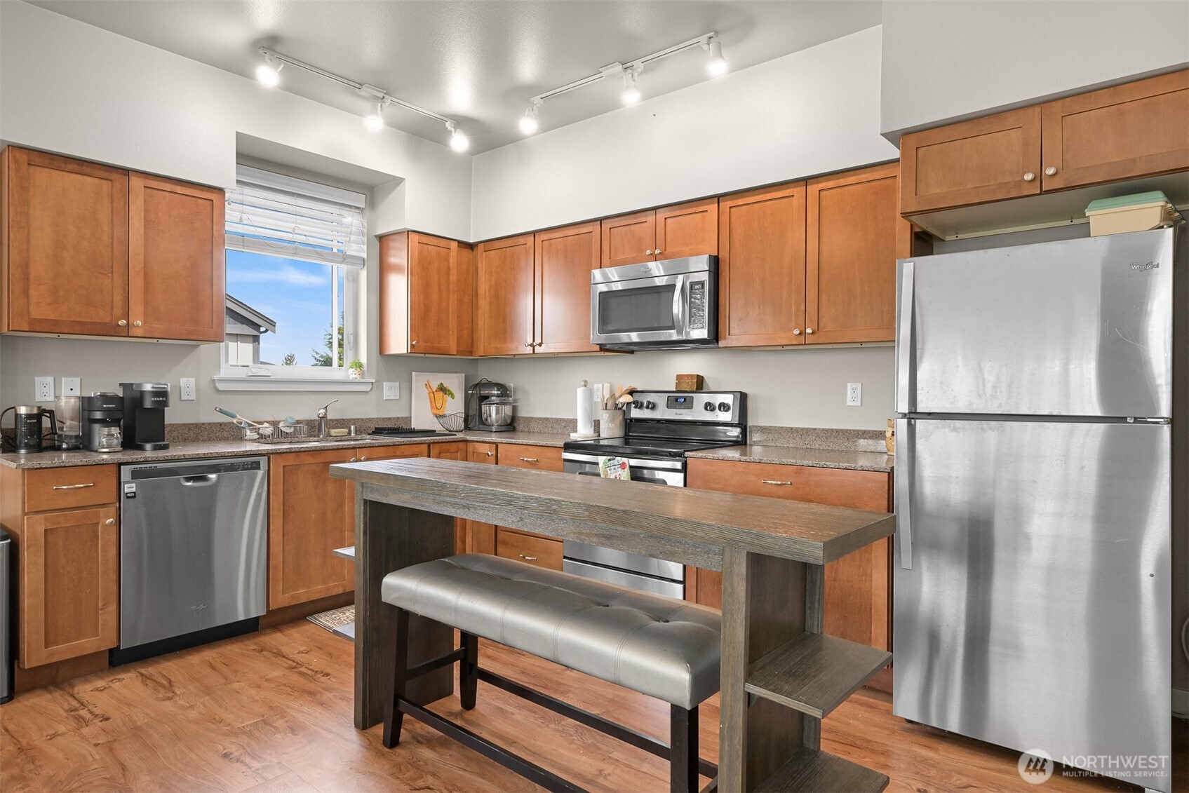 8844 Depot Road, Unit B211 Lynden, WA 98264 - Photo 9 of 29 a kitchen with stainless steel appliances granite countertop a refrigerator a stove a sink and a microwave