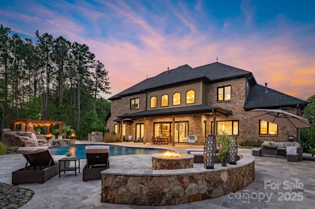 a front view of a house with sitting area