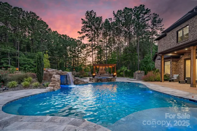 a view of a swimming pool with sitting area