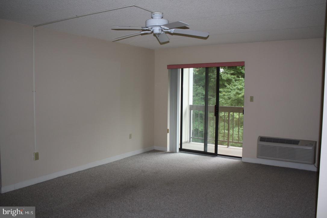 800 Avondale Road, Unit 6C Wallingford, PA 19086 - Photo 6 of 25 a view of room with window and ceiling fan