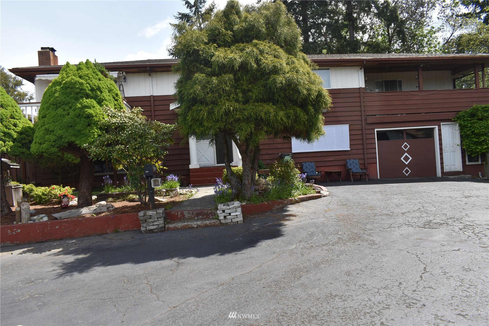 819 Sheridan Road Bremerton, WA 98310 - Photo 1 of 40 a view of a brick house with a large windows