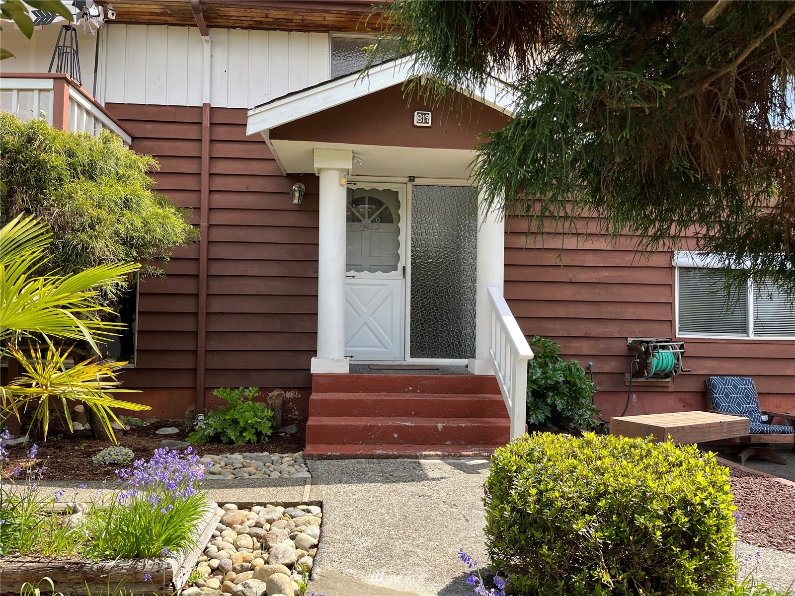819 Sheridan Road Bremerton, WA 98310 - Photo 2 of 40 a view of a house with a yard and potted plants
