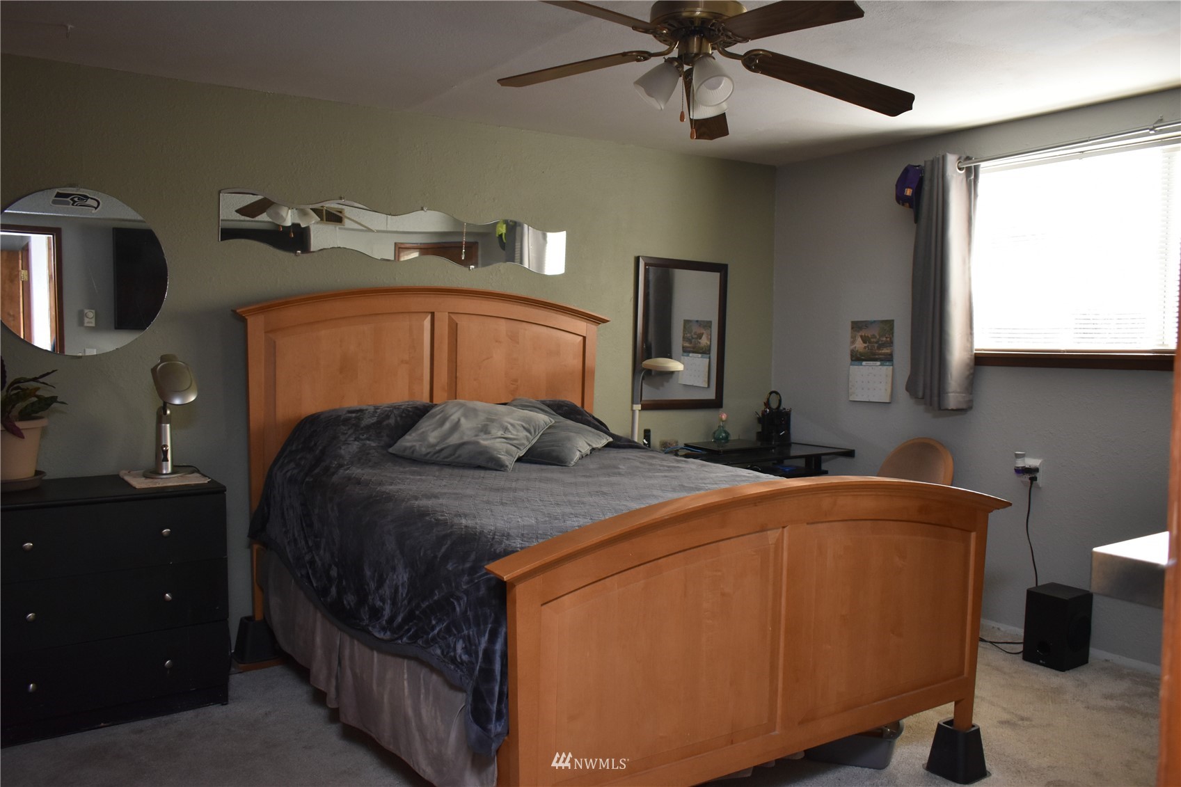 819 Sheridan Road Bremerton, WA 98310 - Photo 26 of 40 a bedroom with a bed and a mirror on the dresser