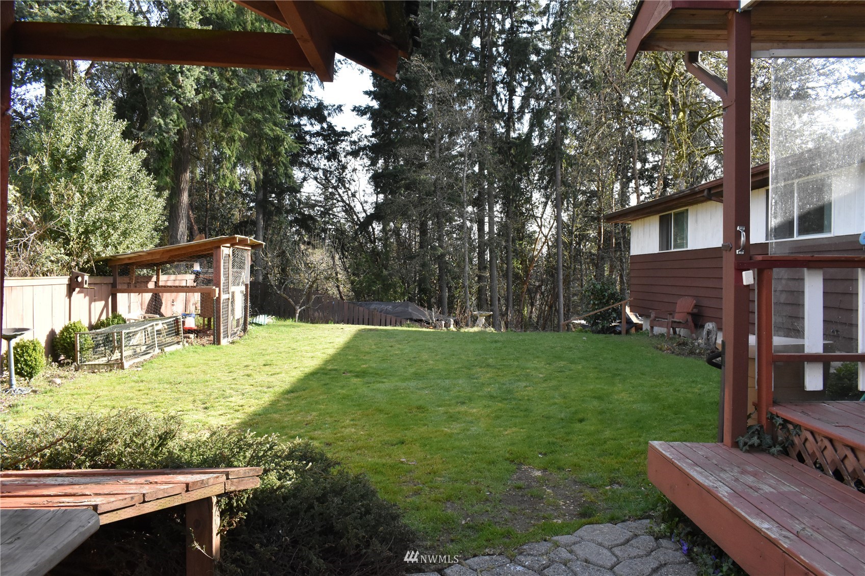 819 Sheridan Road Bremerton, WA 98310 - Photo 30 of 40 a view of a backyard with table and chairs potted plants and large tree