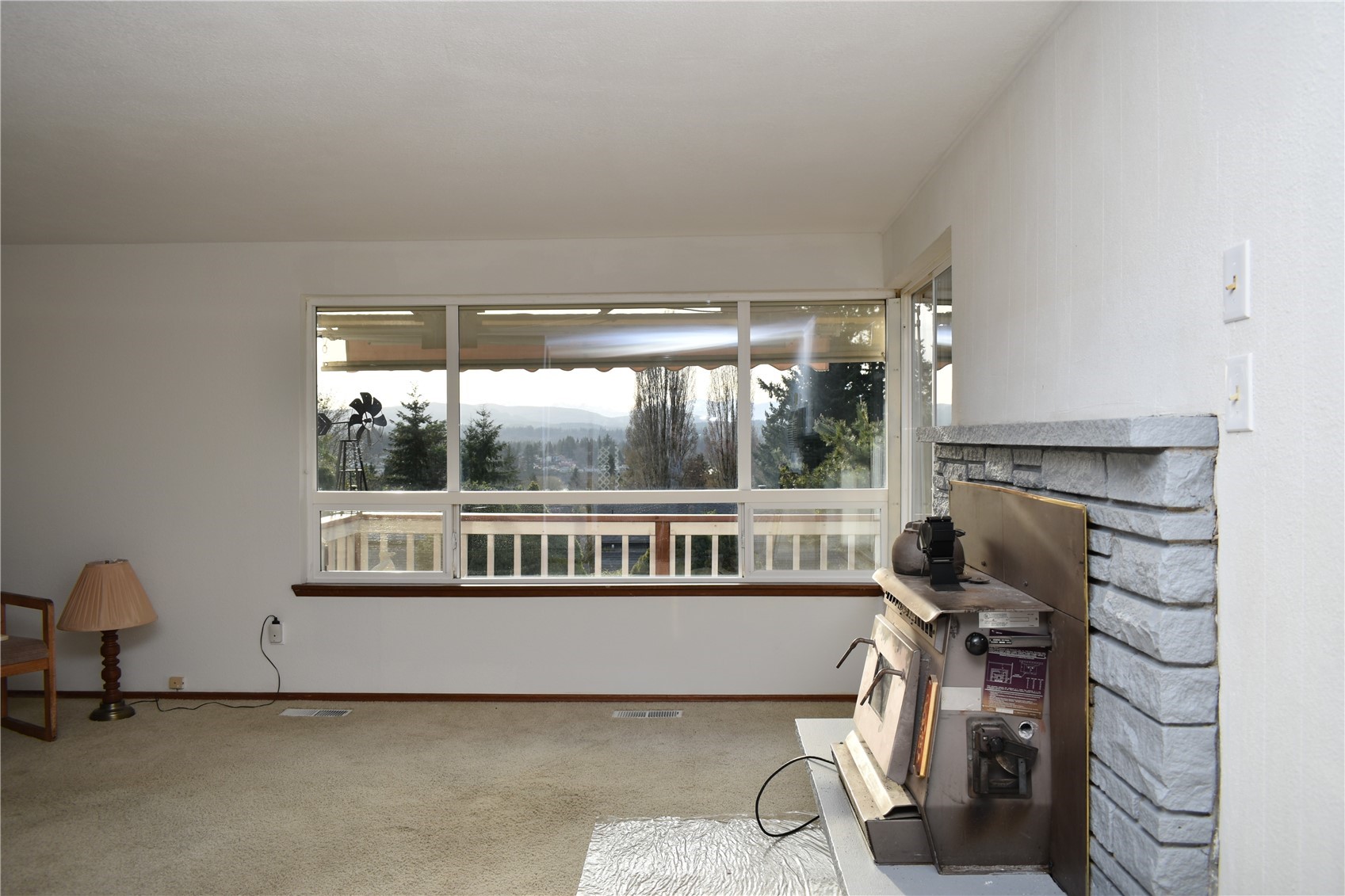 819 Sheridan Road Bremerton, WA 98310 - Photo 6 of 40 a living room with furniture a window and a fireplace