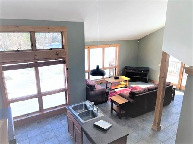 1013 Rock Pond Road, Unit 38 Sandy River Plt, ME 04970 - Photo 8 of 37 Kitchen into Dining Room