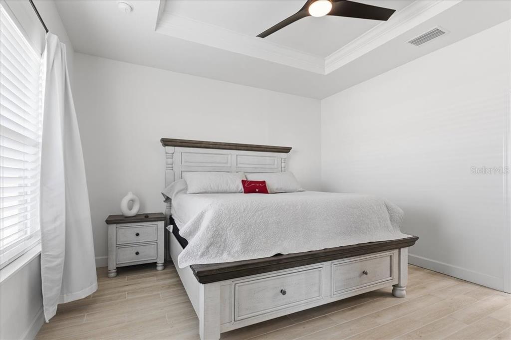 1054 Southwest 67th Street Gainesville, FL 32607 - Photo 14 of 37 a bedroom with a bed and a night stand