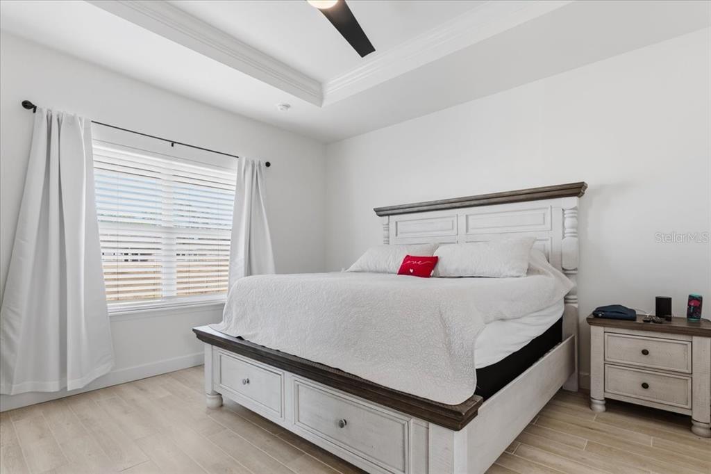 1054 Southwest 67th Street Gainesville, FL 32607 - Photo 15 of 37 a bedroom with a bed and a window