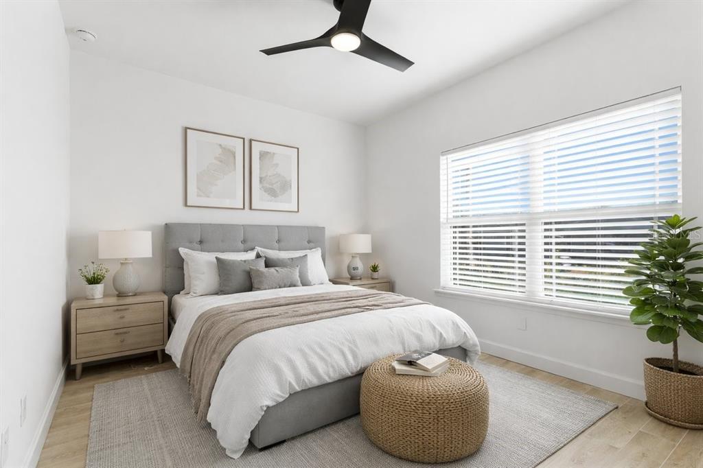 1054 Southwest 67th Street Gainesville, FL 32607 - Photo 22 of 37 a bedroom with a bed and windows