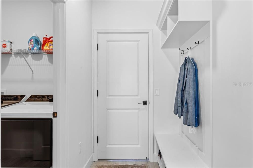 1054 Southwest 67th Street Gainesville, FL 32607 - Photo 25 of 37 a view of walk in closet with clothes and shoes
