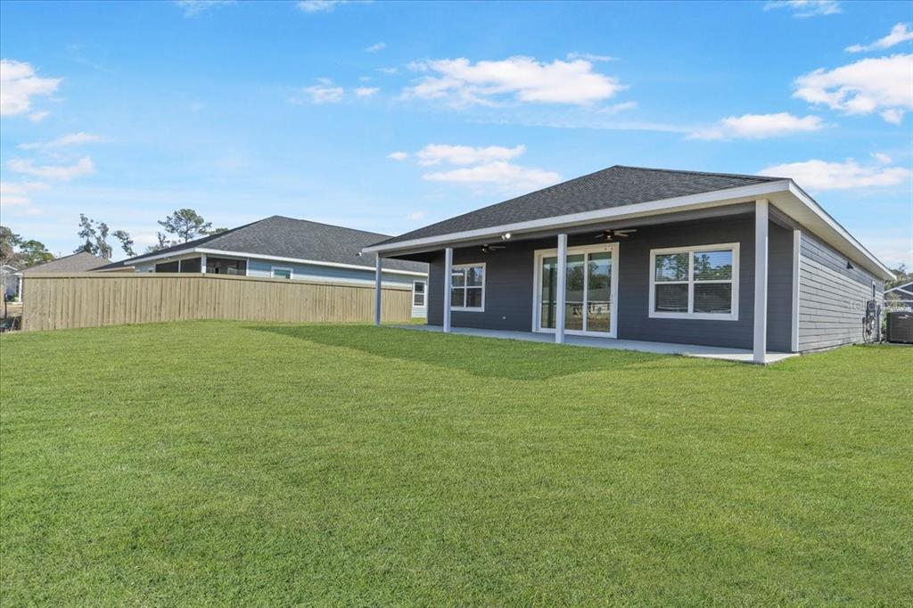 1054 Southwest 67th Street Gainesville, FL 32607 - Photo 29 of 37 a front view of a house with a garden