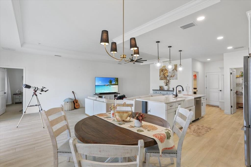 1054 Southwest 67th Street Gainesville, FL 32607 - Photo 7 of 37 a large kitchen with a table and chairs