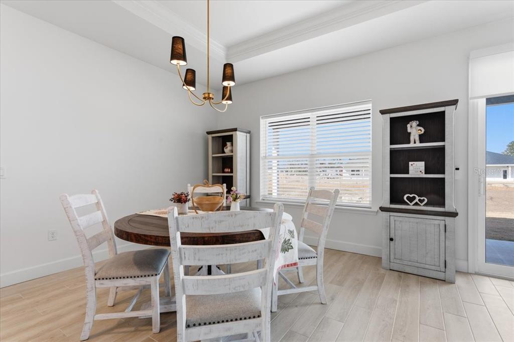 1054 Southwest 67th Street Gainesville, FL 32607 - Photo 8 of 37 a view of a dining room with furniture and window