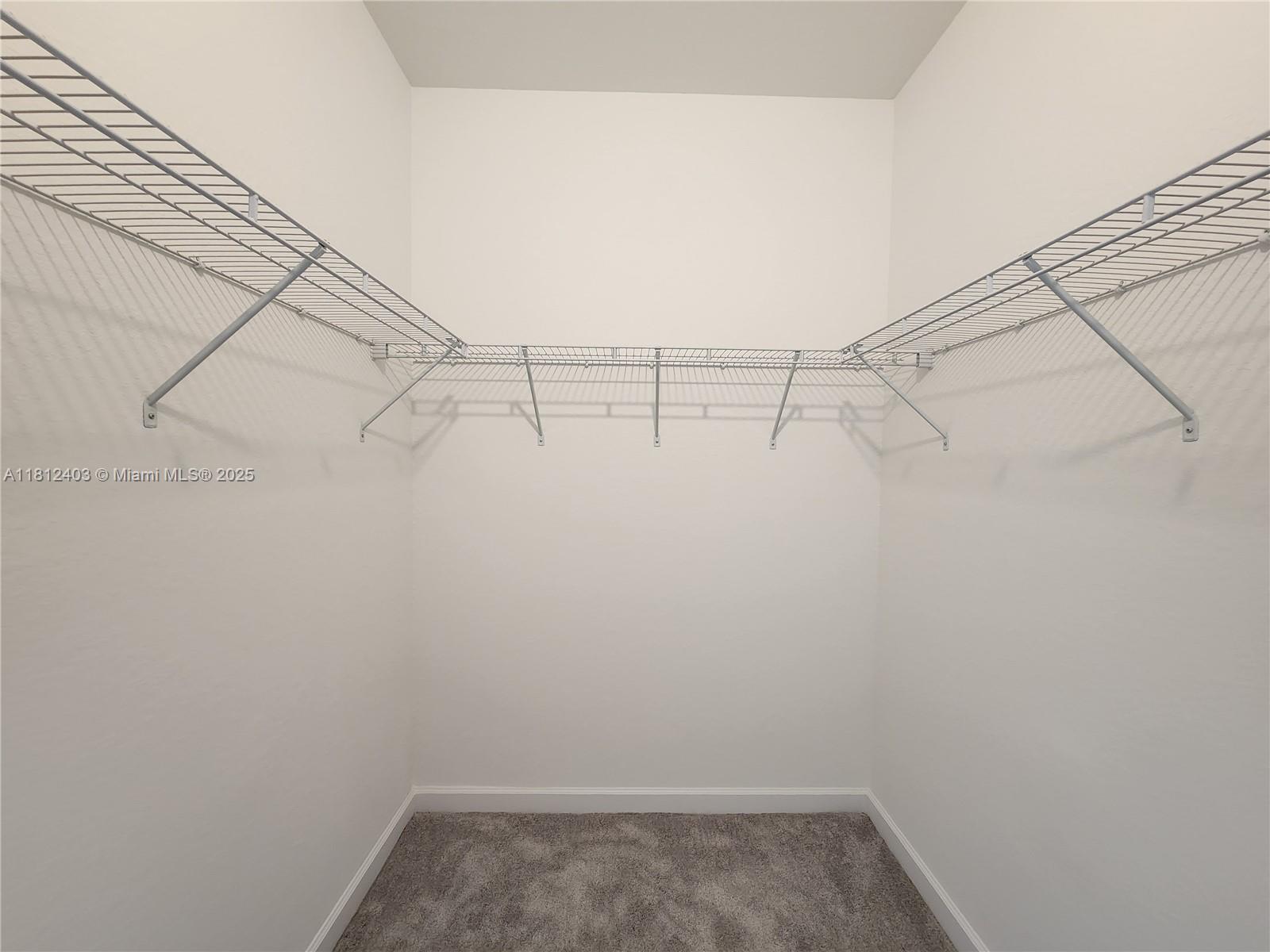 12959 Southwest 229th Lane Miami, FL 33170 - Photo 17 of 28 a view of a room with racks on the wall