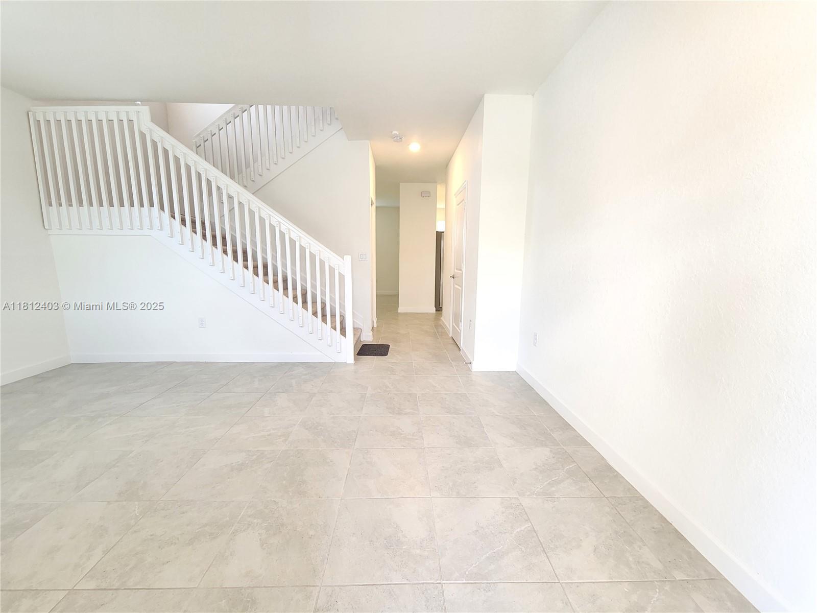 12959 Southwest 229th Lane Miami, FL 33170 - Photo 3 of 28 a view of a hallway