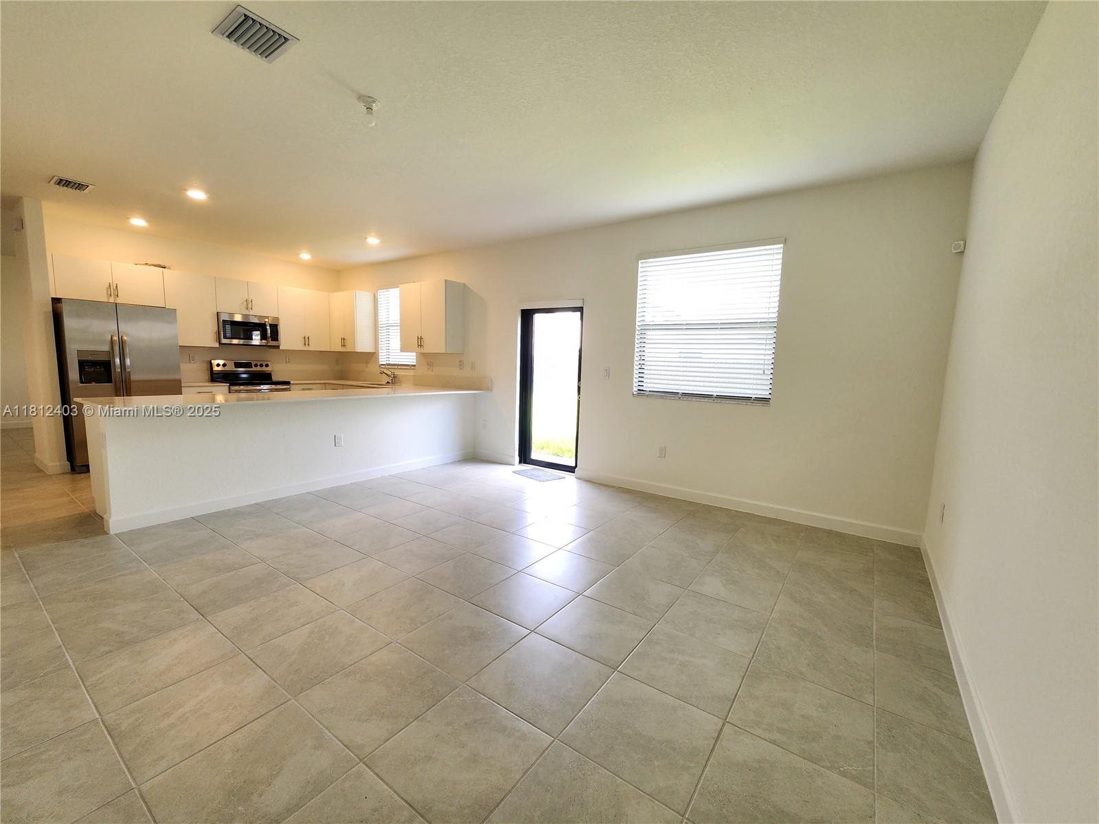 12959 Southwest 229th Lane Miami, FL 33170 - Photo 10 of 28 a view of a kitchen and a window
