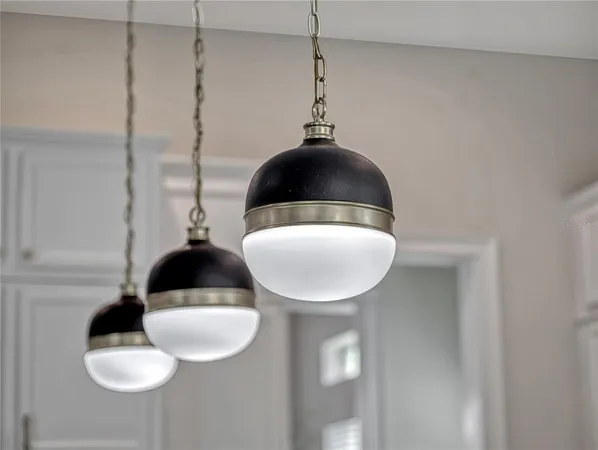 a front view of a house with pool table and chairs