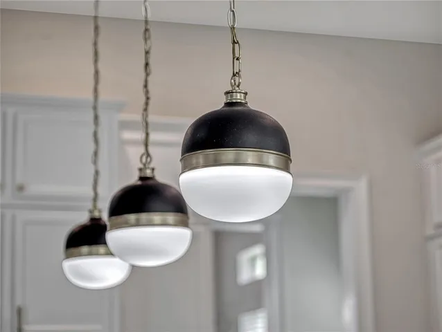 a front view of a house with pool table and chairs