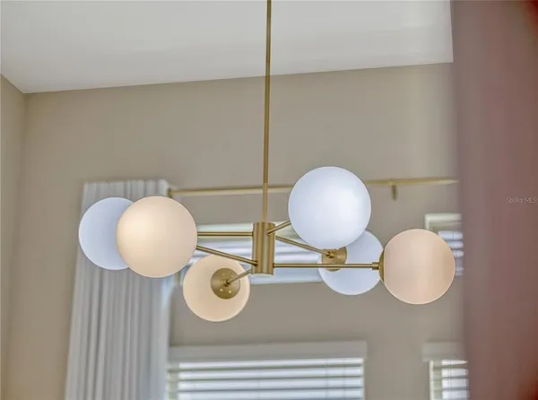 a bathroom with a mirror and vanity