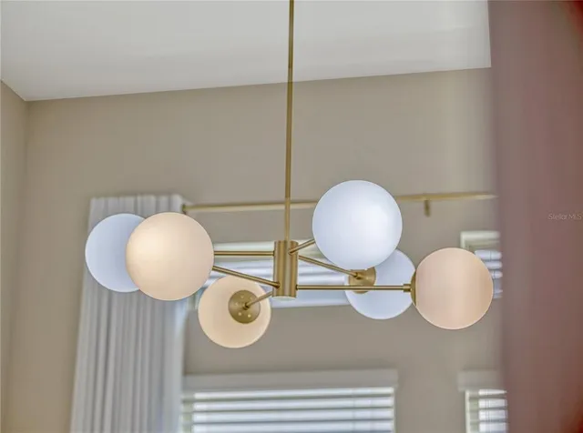 a bathroom with a mirror and vanity