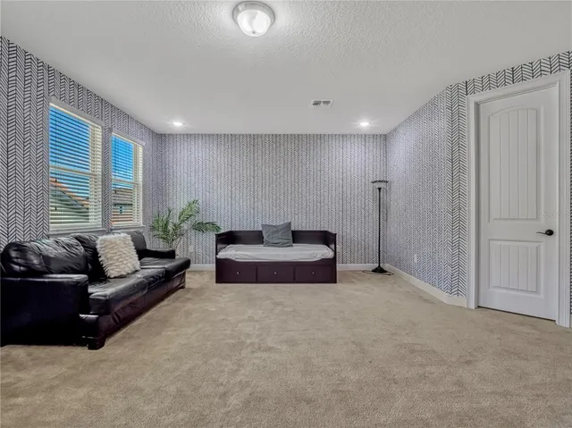 a view of a livingroom with furniture and window