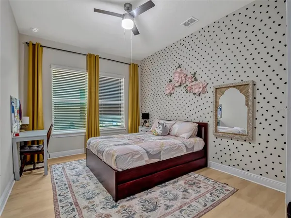 a bedroom with a bed and a table