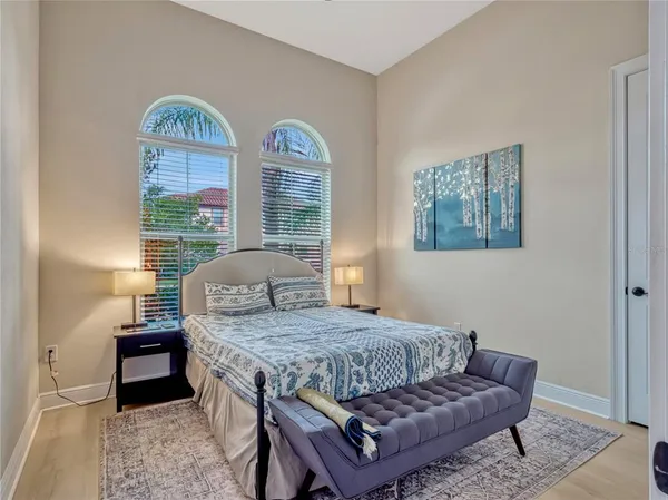 a bathroom with a double vanity sink toilet and shower