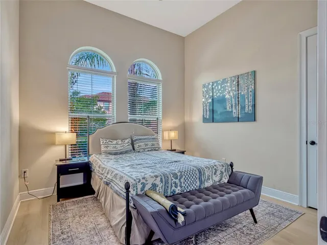 a bathroom with a double vanity sink toilet and shower