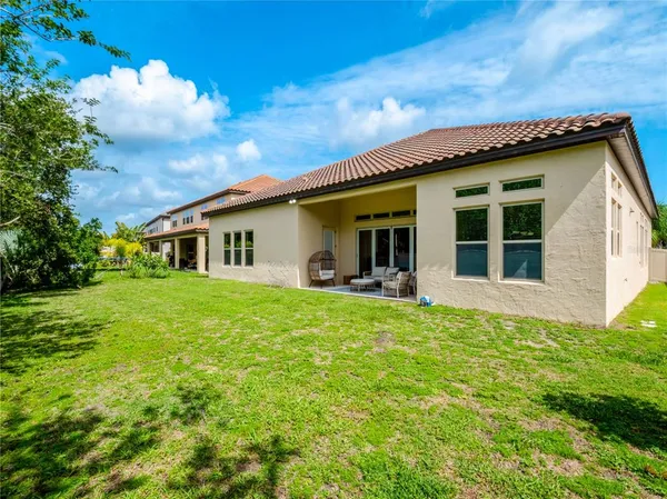 a swimming pool with outdoor seating yard and barbeque oven
