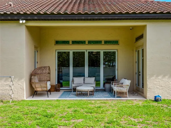 a roof deck with a table and chairs