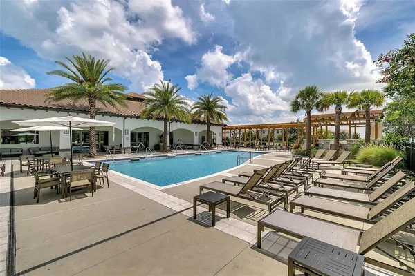 a view of a backyard with plants and patio