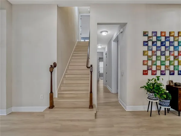 a view of entryway with wooden floor
