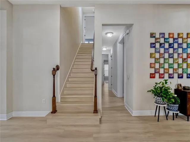 a view of entryway with wooden floor
