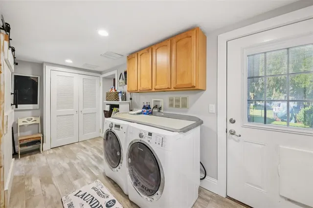 a view of a kitchen with washer and dryer