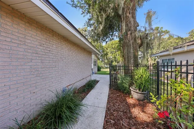 a backyard of a house with lots of green space