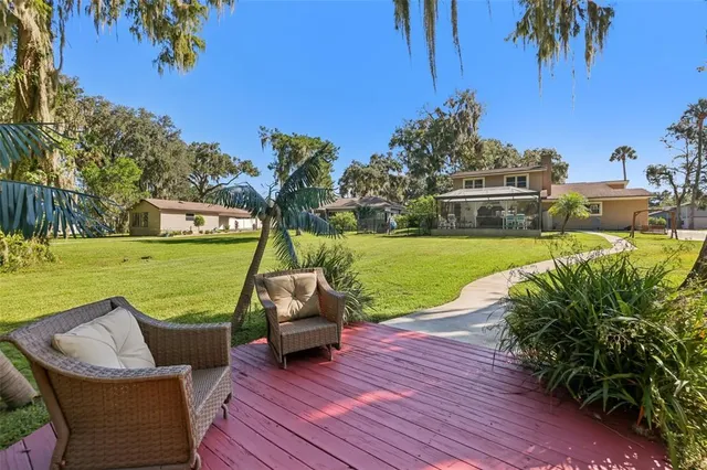 a view of a swimming pool and lounge chairs