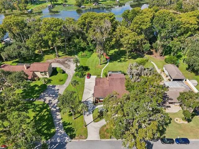 an aerial view of a house with a yard